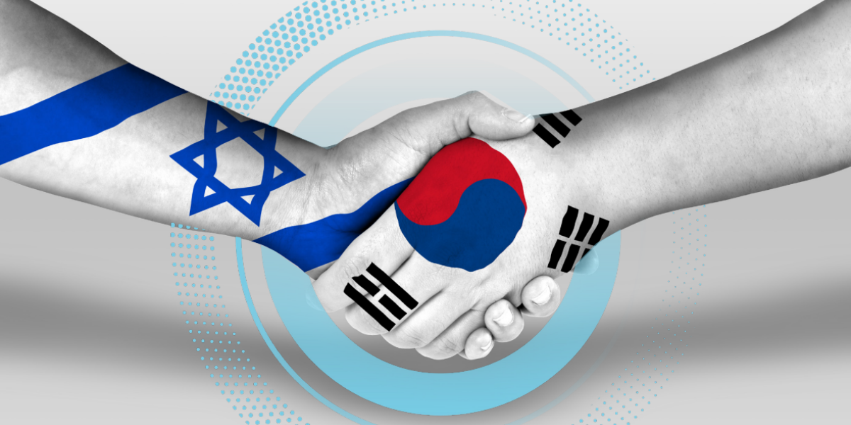 לחיצת ידיים עם דגל קוראיה ודגל ישראל